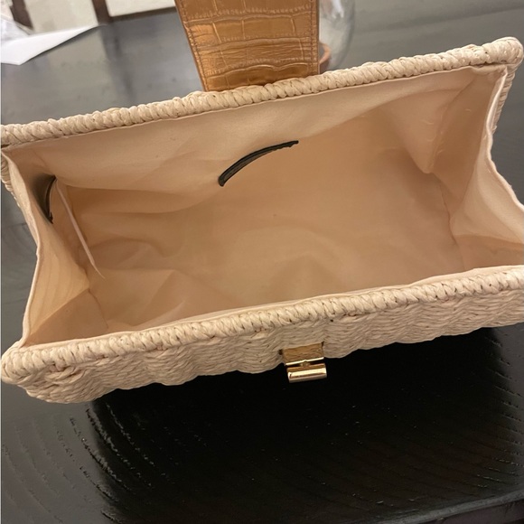 Ann Taylor straw woven clutch with gold accents. Fold over toggle closure. - Picture 11 of 12